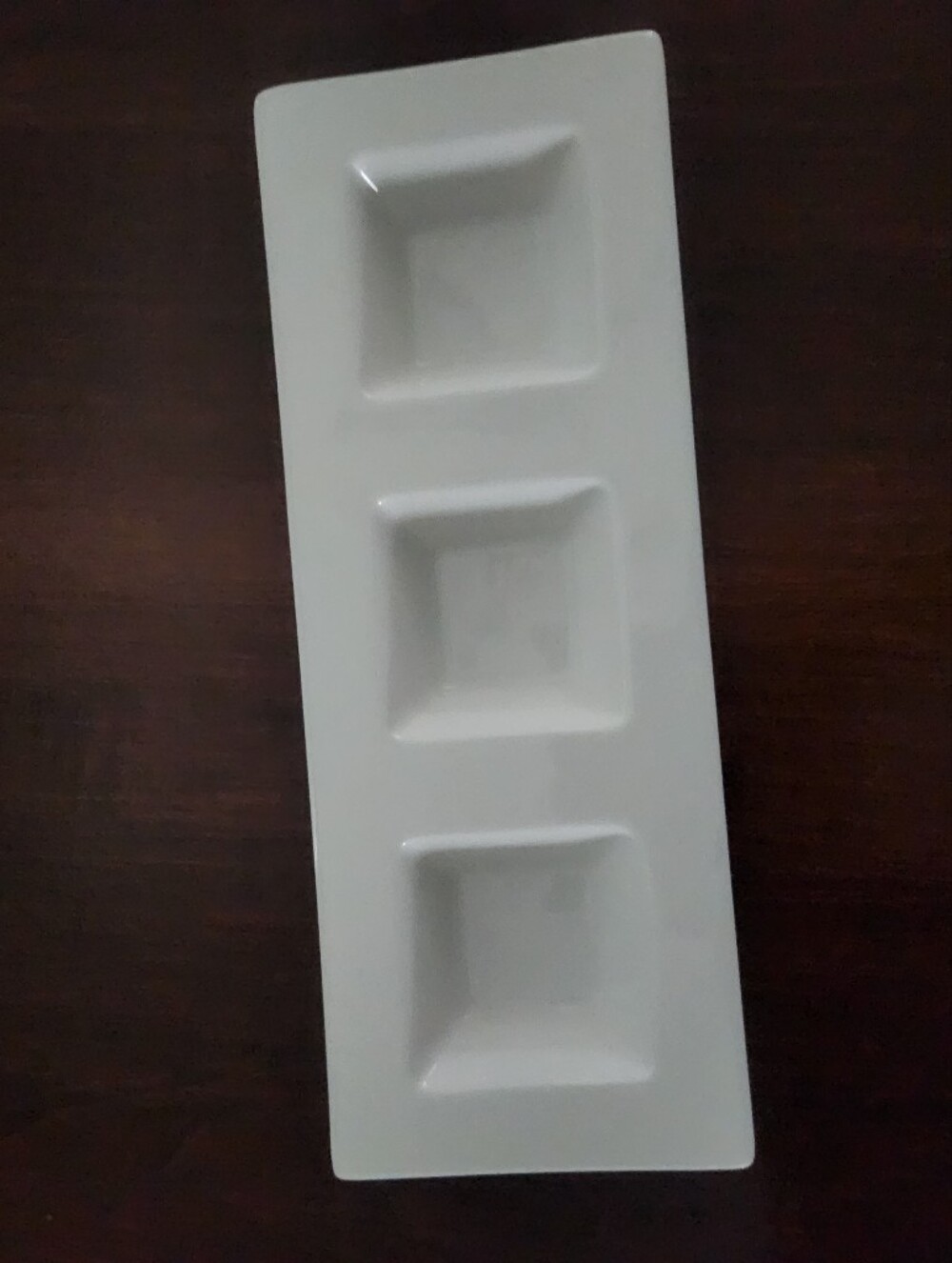 Ceramic rectangular divided serving dish.
